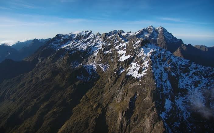 Aerial view of the glaciated Rwenzori Mountains at dawn, snow-capped equatorial peaks on the Uganda border, Africa