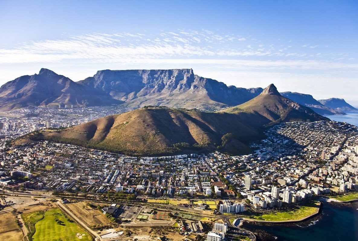 Aerial view of Table Mountain's flat-topped summit rising above Cape Town and Table Bay, South Africa